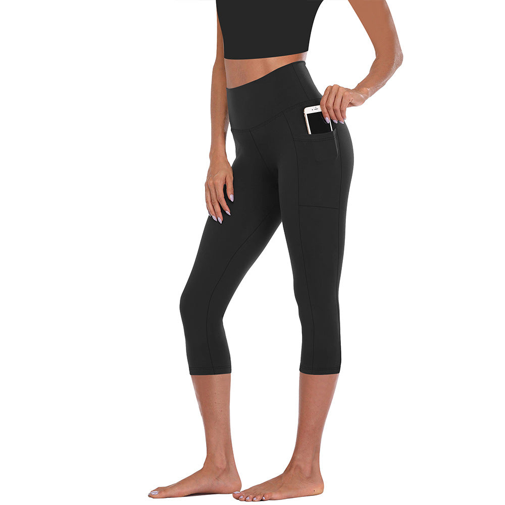 Athletic women's leggings with convenient side pockets, tummy control & compression for active workouts.