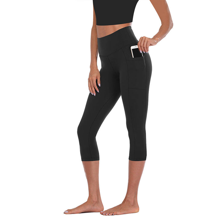 Athletic women's leggings with convenient side pockets, tummy control & compression for active workouts.