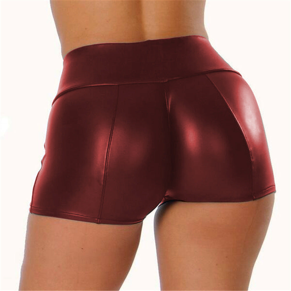 Durable shiny high-waisted sports shorts, great for women's gym, yoga & active lifestyles.