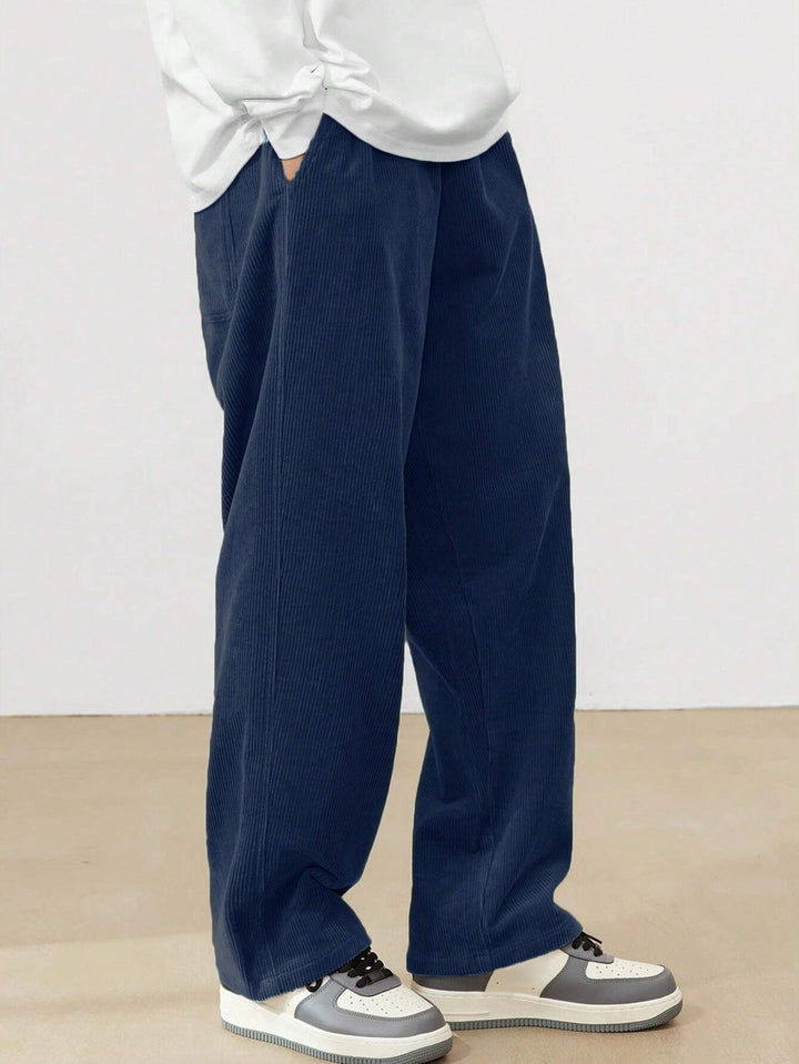 Comfortable men's wide leg pants with elastic waistband, perfect for a relaxed modern fit.