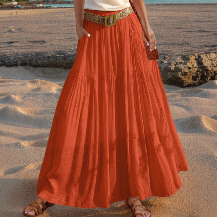 Casual yet elegant pleated long skirt with pockets, perfect for women's summer fashion.