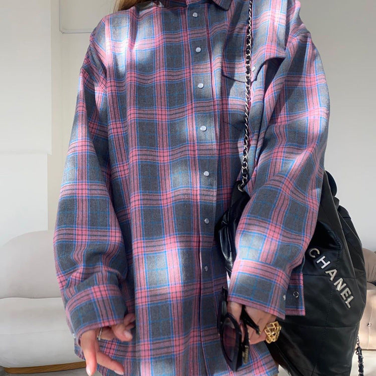 Comfortable women's oversized plaid shirt, long-sleeve button-up, great for layering or standalone wear.