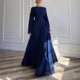 Long tiered gala dress with graceful flowing bell sleeves. Ideal women's formal evening wear.