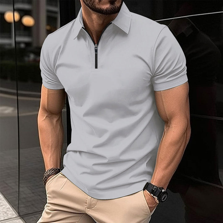 Men's versatile performance zip polo in a classic color, perfect for casual or active fashion.