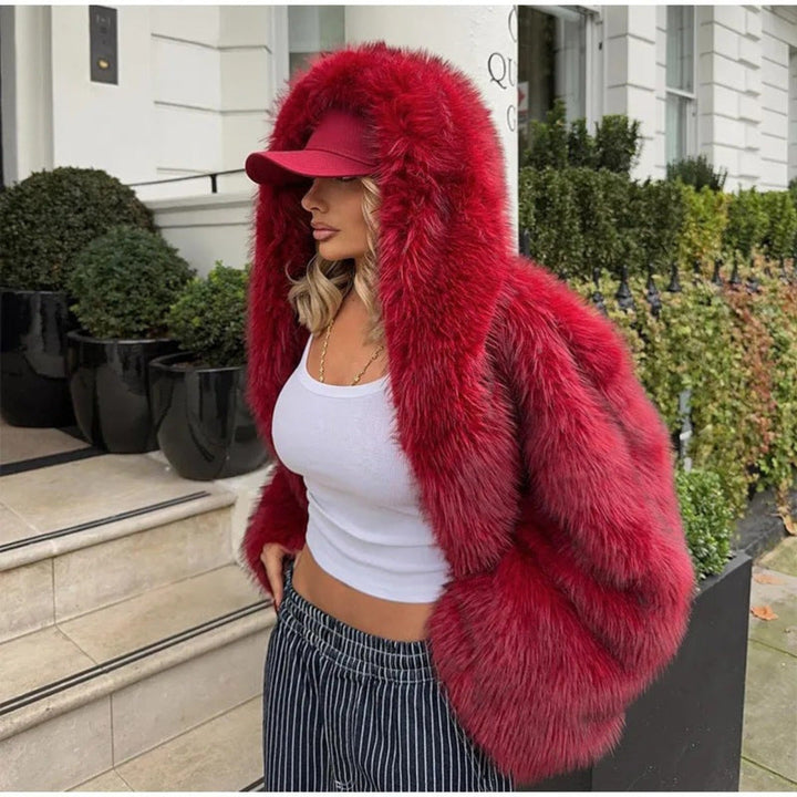 Stylish women's faux coat with hood & long sleeves, a warm outerwear piece for elegant fall outfits.