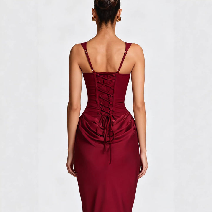Women's elegant black formal dress, figure-hugging design showcasing a sleek side silhouette, great for evening wear.
