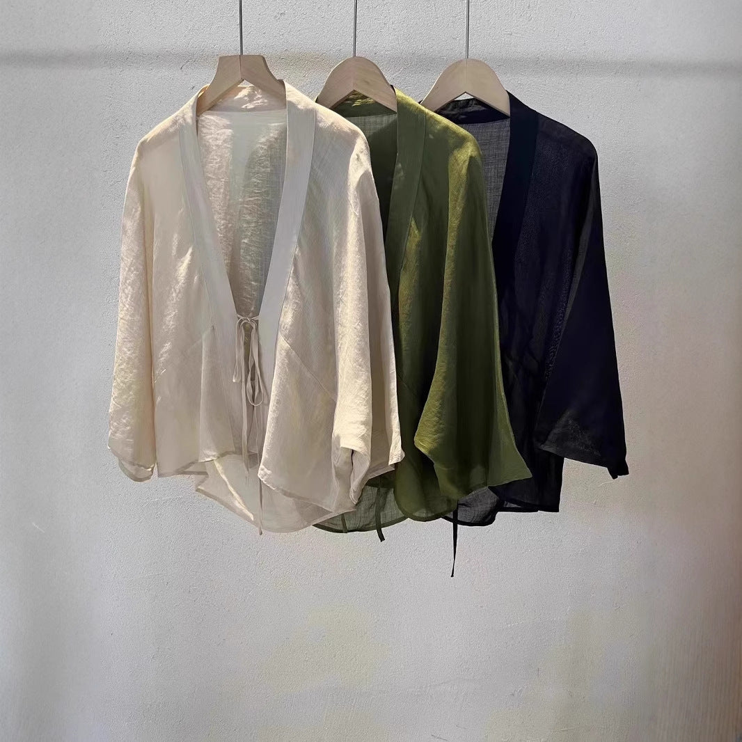 Elegant women's sheer wrap jacket, ideal as a stylish lightweight cover-up for beach wear or summer fashion.