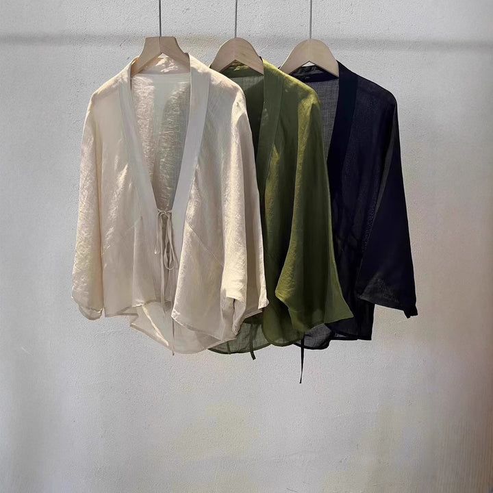 Elegant women's sheer wrap jacket, ideal as a stylish lightweight cover-up for beach wear or summer fashion.