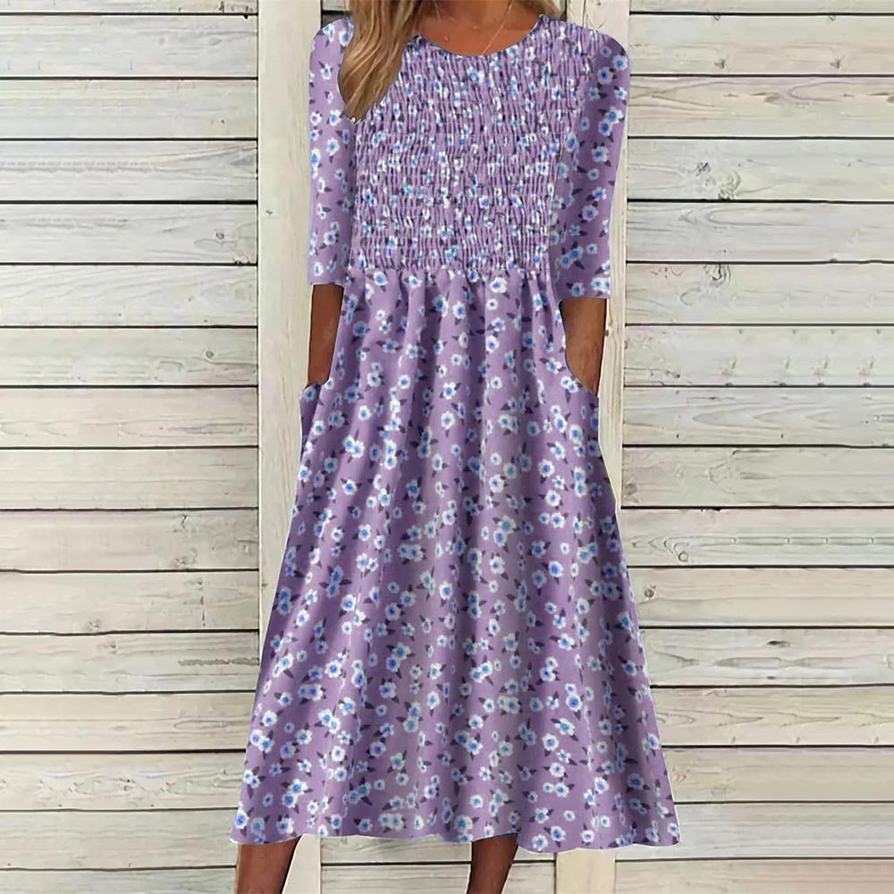 Vibrant floral smocked midi dress for women, embodying spring style. A must-have versatile summer dress.