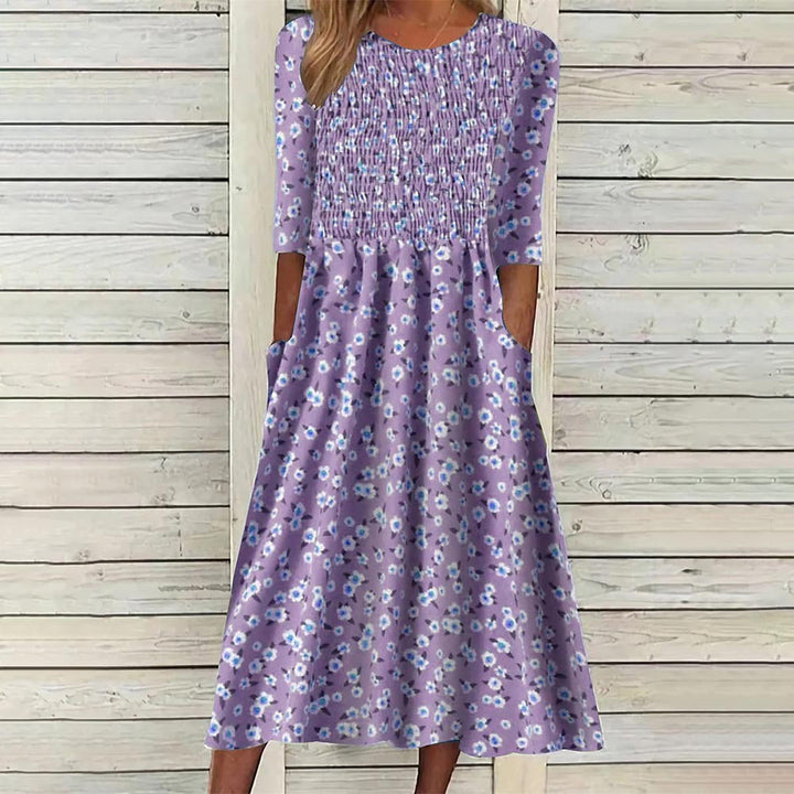 Vibrant floral smocked midi dress for women, embodying spring style. A must-have versatile summer dress.