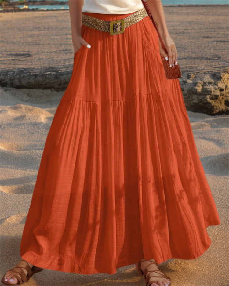 Elegant women's pleated long skirt with practical pockets, ideal for everyday style.