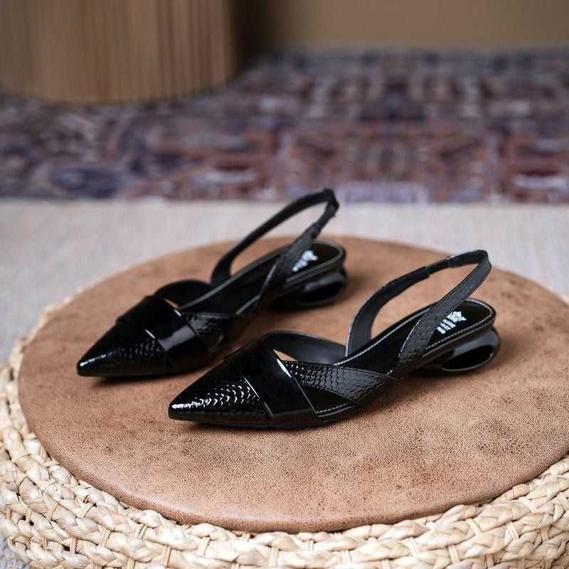 Formal women's dress shoes: silver slingback heels with elegant metallic pointed toe and stiletto heel.
