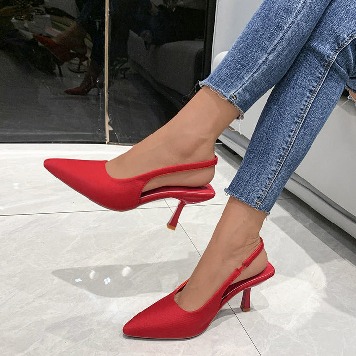 Comfortable low-heel black slingback pumps for women, featuring a chic pointed toe design.