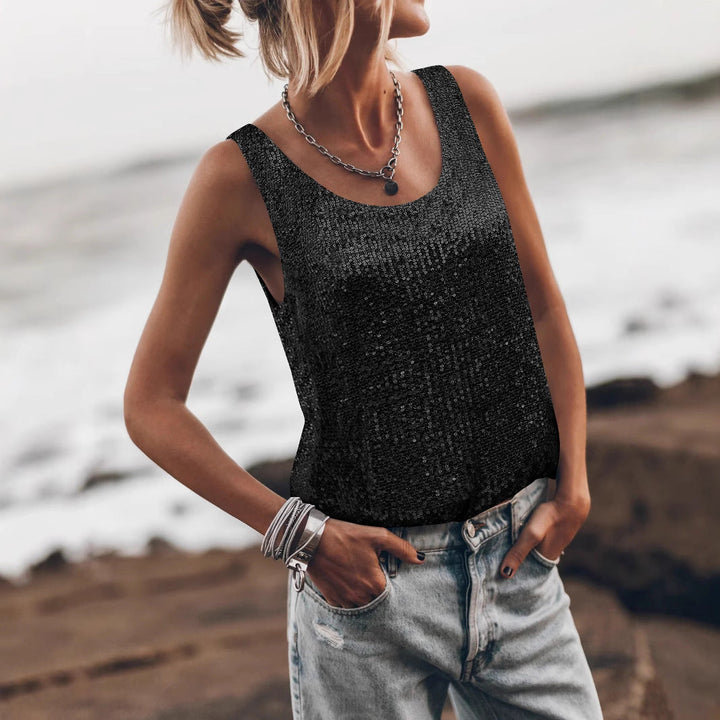 Glamorous women's shiny sleeveless top, ideal for stylish party wear, adds sparkle to any fashion look.