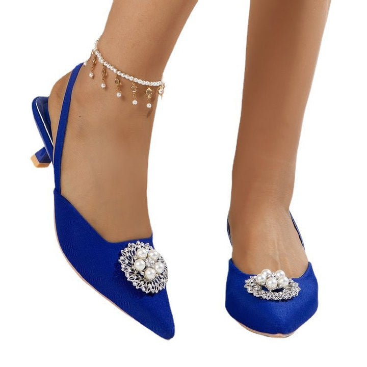 Stylish women's high-heel slingbacks featuring a sleek pointed toe and lustrous pearl embellishments.