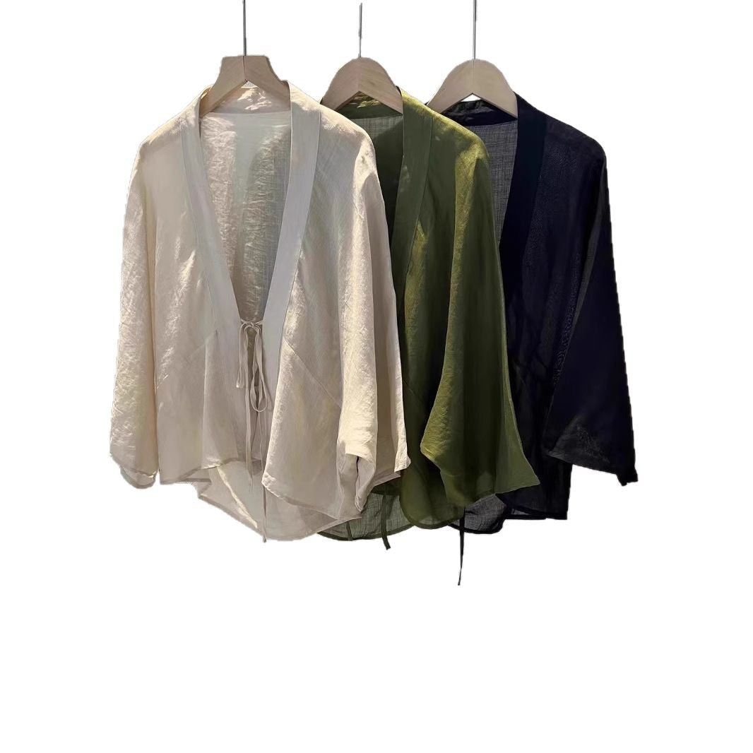 Lightweight women's sheer wrap jacket, a trendy fashion cardigan for chic layering and warm weather style.