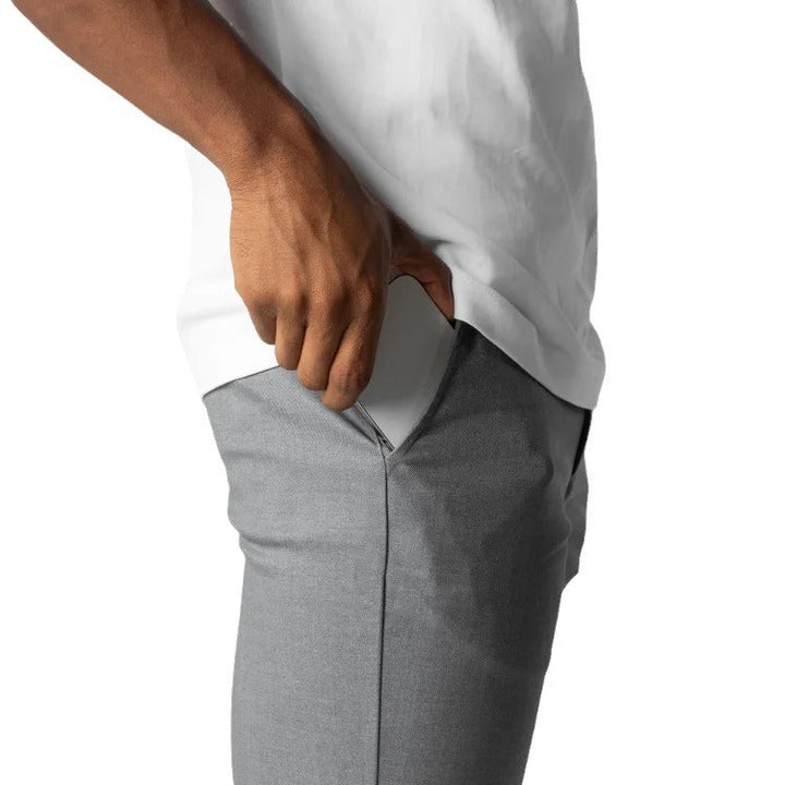 High-quality men's slim fit chino pants with comfortable elastic waist, excellent for versatile everyday wear.