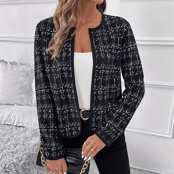 Women's chic structured blazer, elegant contrast details. Perfect for professional or smart casual attire.