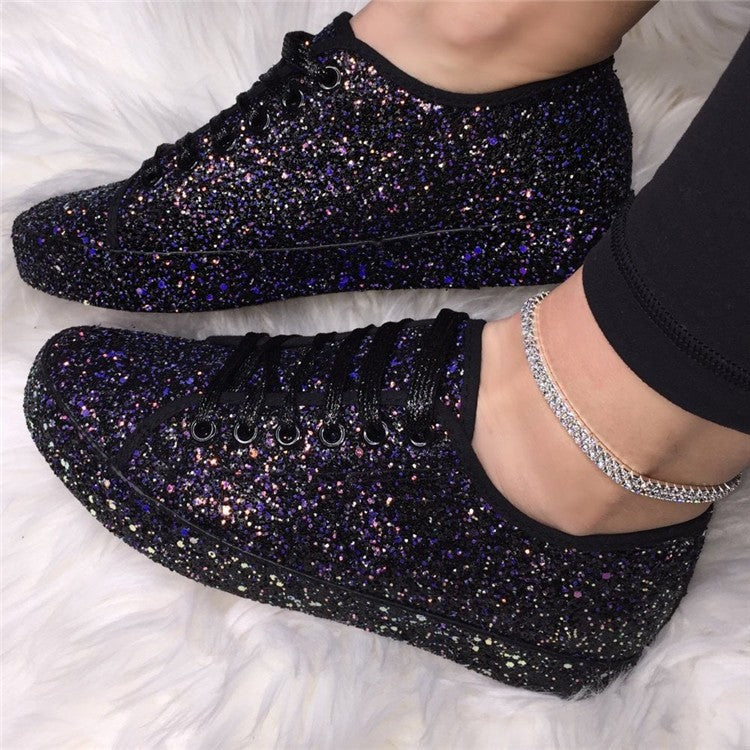 Front view of women's sparkling casual sneakers. Dazzling glitter finish & comfortable design for everyday style.