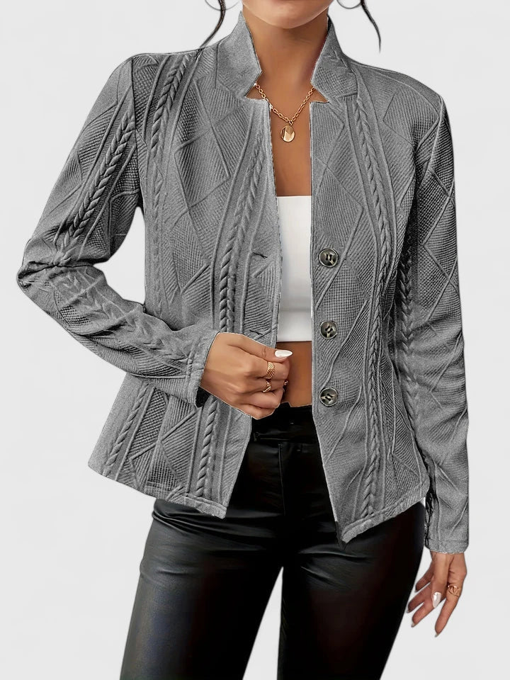 Versatile women's fashion blazer, a stylish layering piece for professional attire or elegant casual looks.