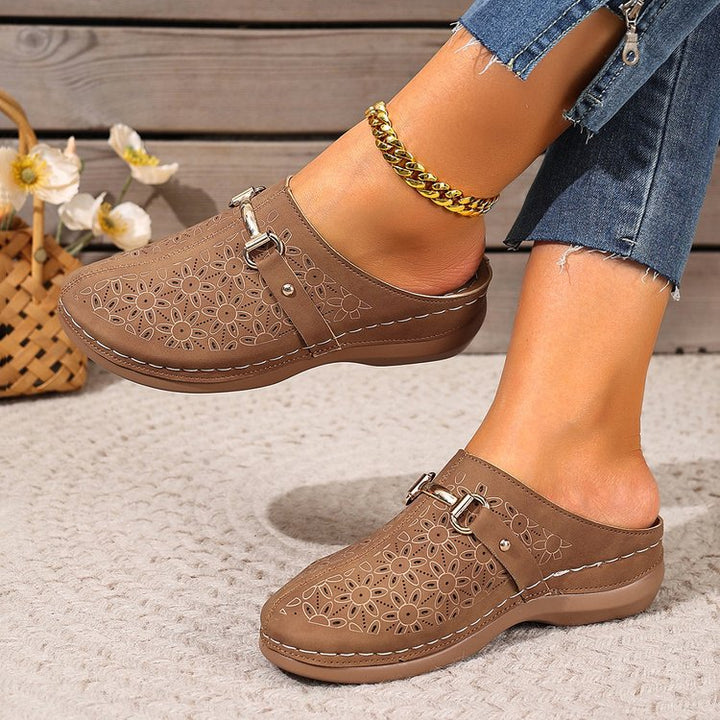 Close-up of women's floral pattern clogs, comfortable slip-on shoes perfect for spring & casual wear.