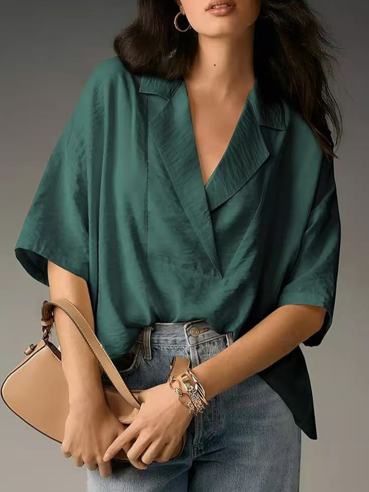 Professional women's V-neck workwear blouse. Chic long sleeve top with an elegant loose fit.