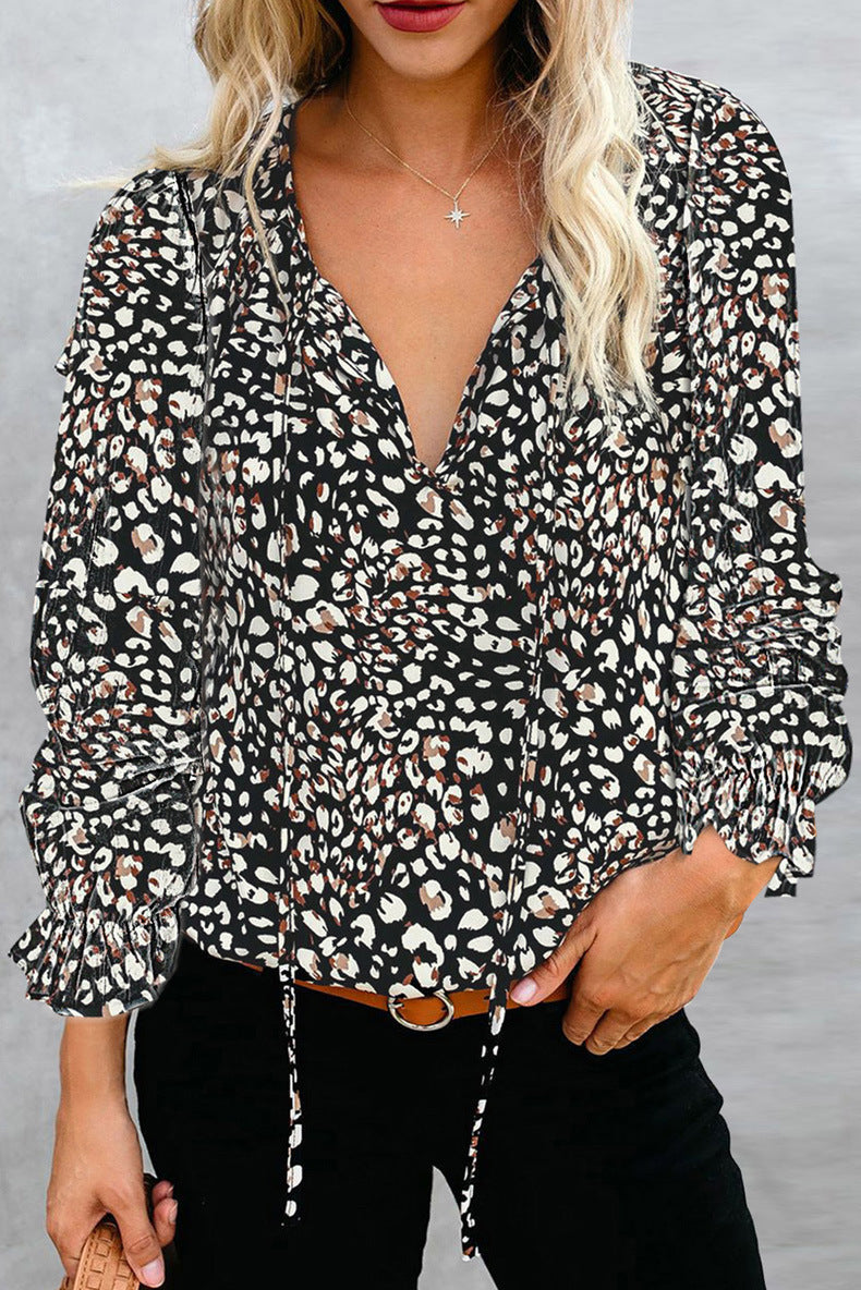 Feminine V-neck ruffle blouse for women, a comfortable and elegant fashion top.