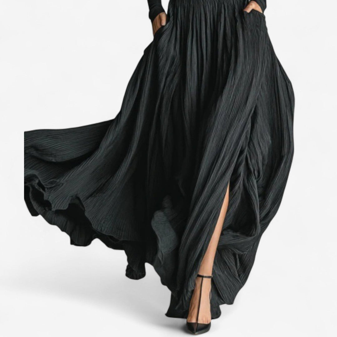 Chic women's long black maxi dress. High-waisted design with an elegant side slit, ideal for evening wear & occasions.