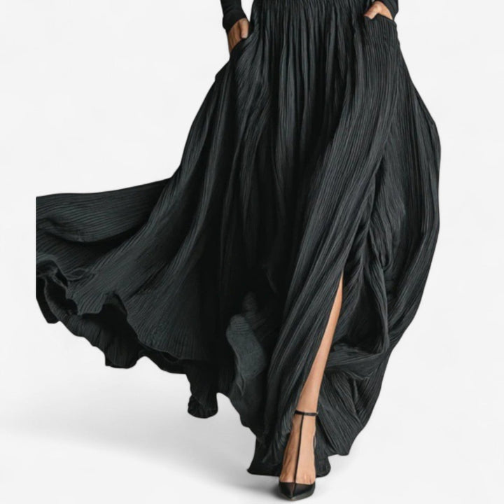 Chic women's long black maxi dress. High-waisted design with an elegant side slit, ideal for evening wear & occasions.