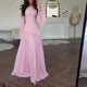 Elegant women's evening gown; a tiered maxi dress with flowing bell sleeves for gala events.