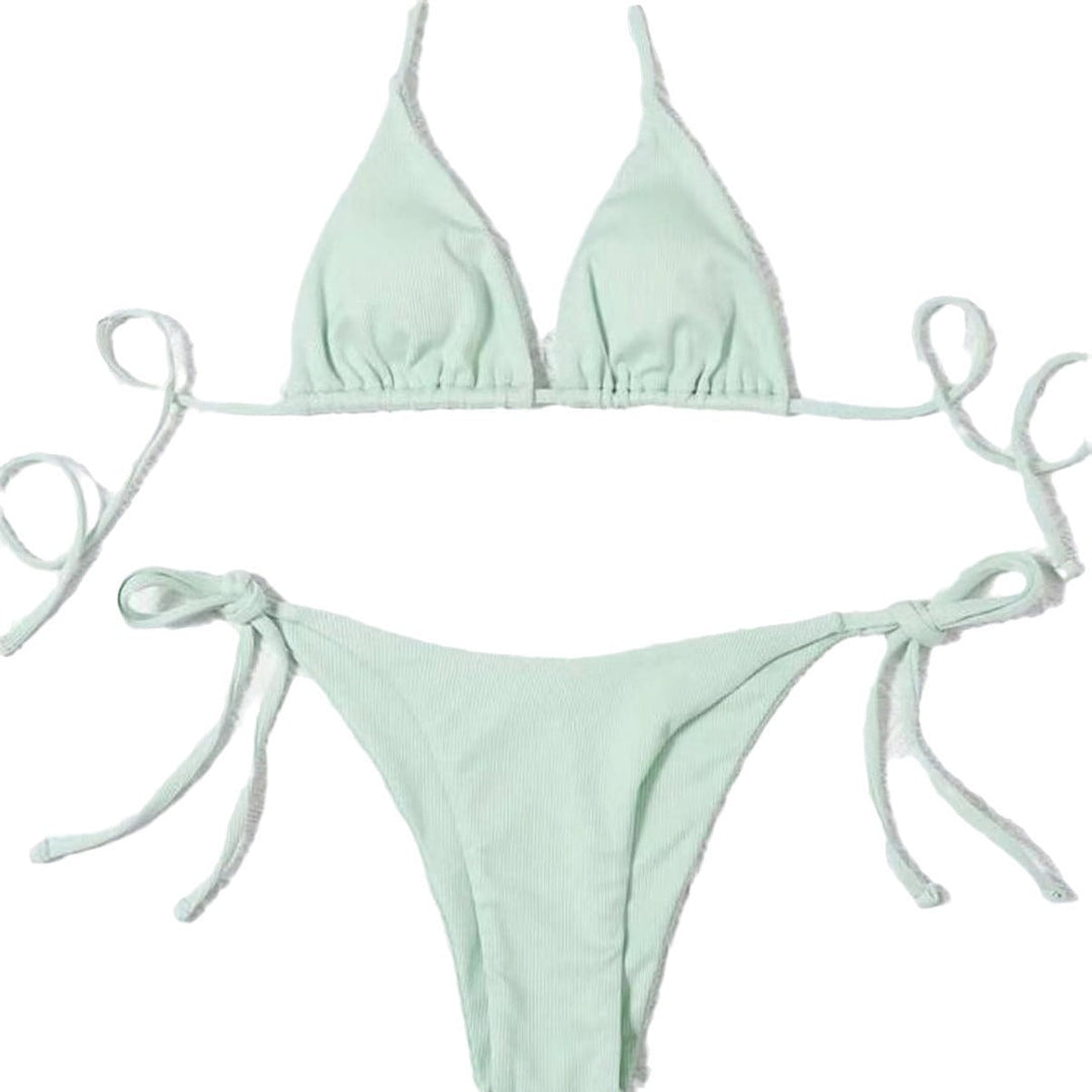 Confident woman in a striped tie-front bikini. Ready for a sunny beach vacation & summer style.