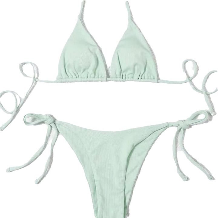 Confident woman in a striped tie-front bikini. Ready for a sunny beach vacation & summer style.