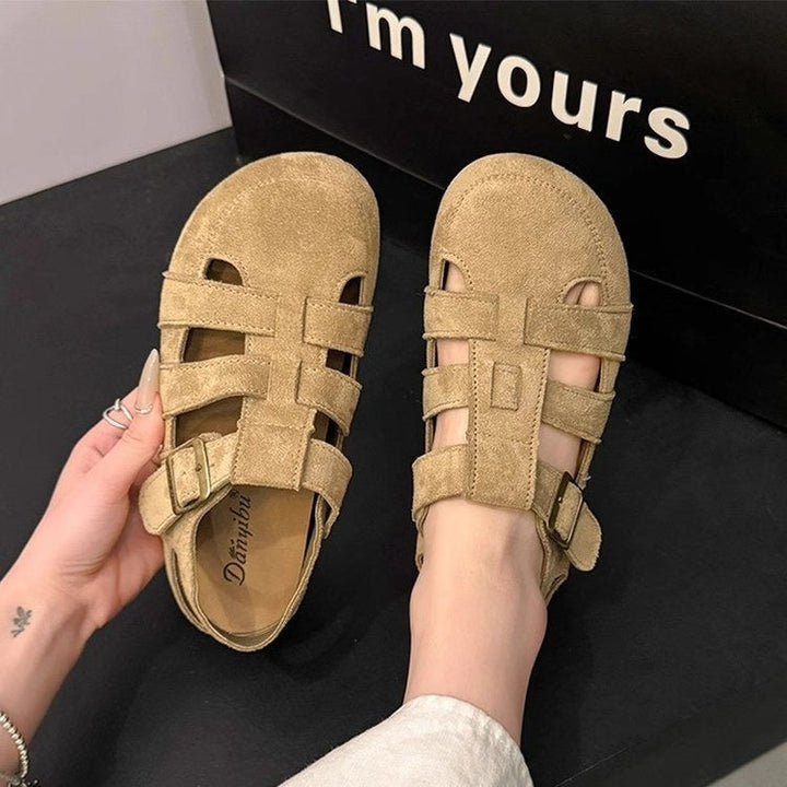 Women's black strappy sandals with adjustable straps, non-slip sole, perfect for summer casual wear.