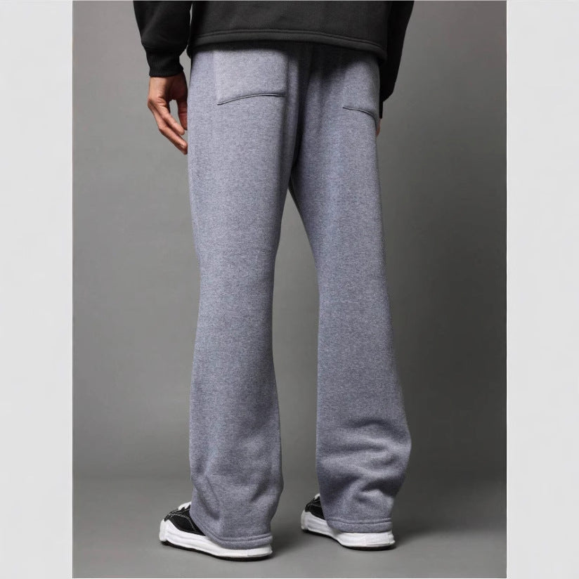Comfortable men's flared sweatpants with a relaxed fit, ideal as stylish loungewear or casual trousers.
