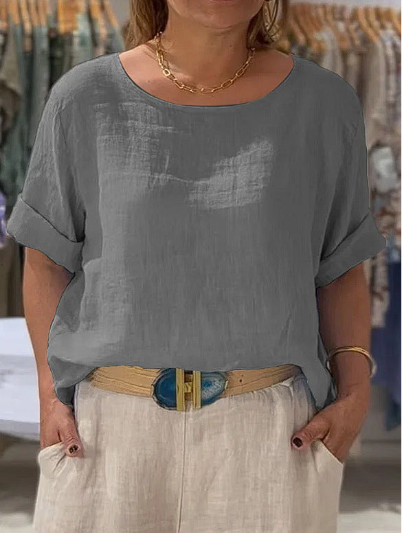 Summer style women's blouse, lightweight, relaxed fit, fashionable rolled sleeves. Comfortable chic top.