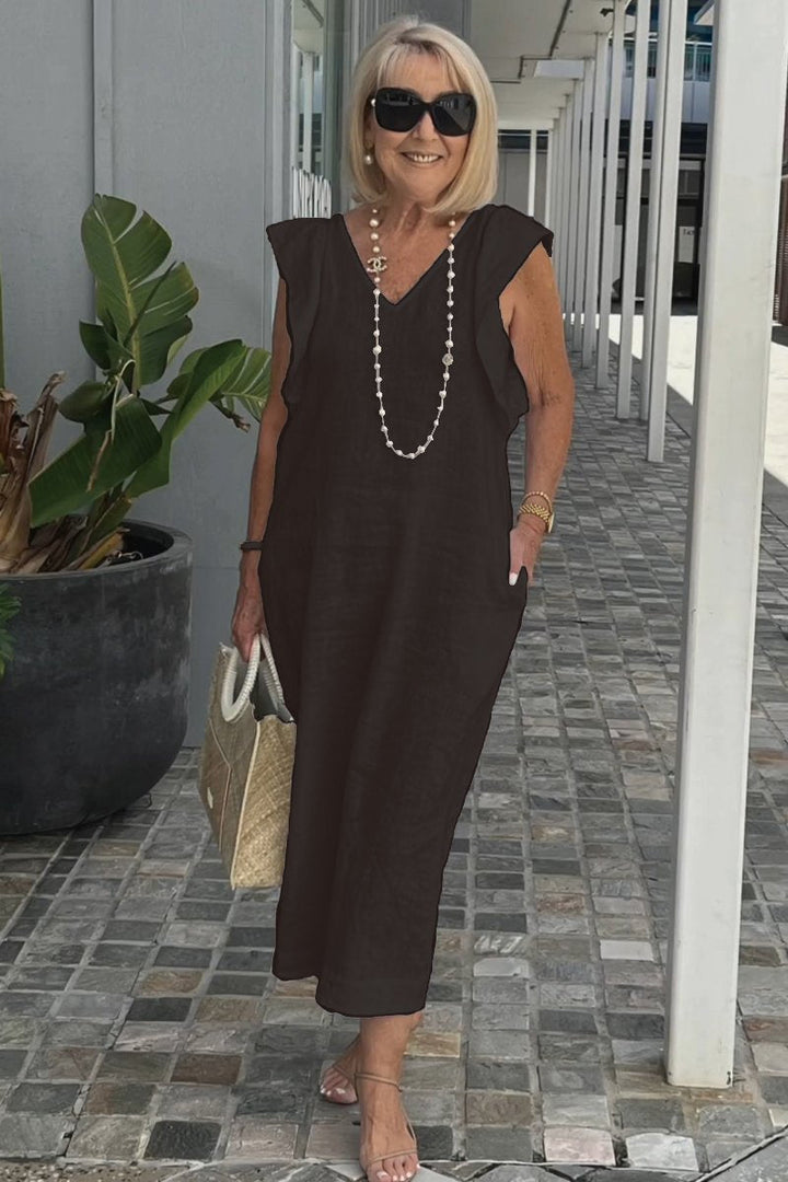 Elegant flowy maxi dress for women, a chic sleeveless V-neck summer style in comfortable apricot hue.