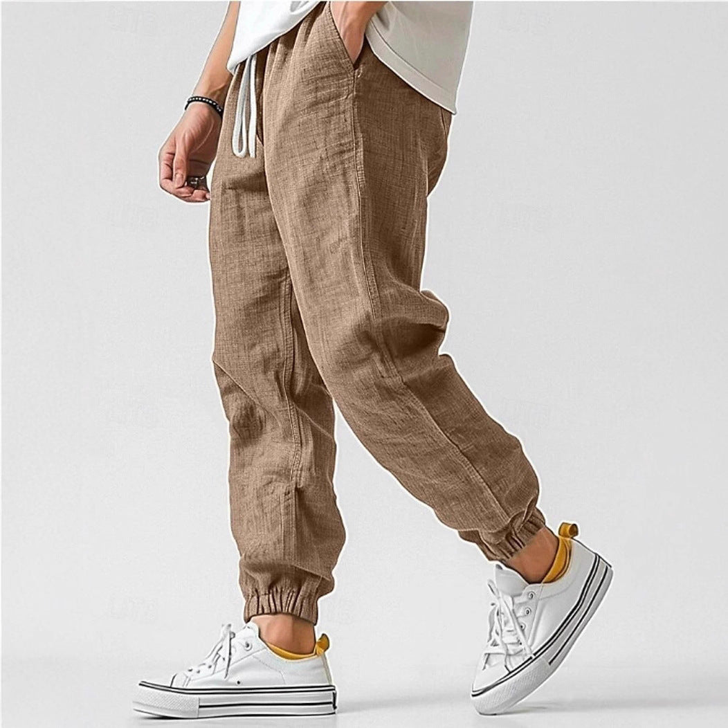 Men's casual pants with elastic waist & side pockets, offering a comfortable relaxed fit.
