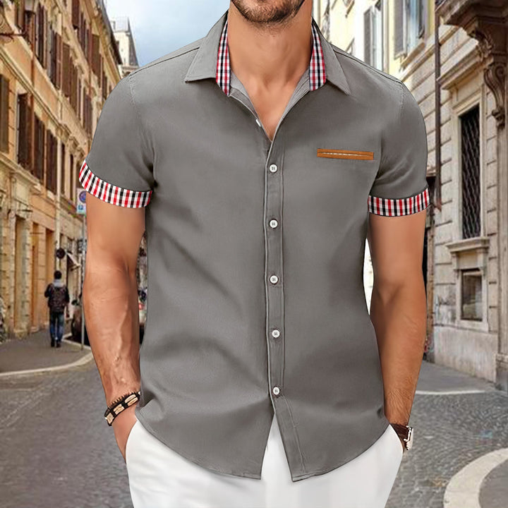 Versatile men's short sleeve top for everyday wear, featuring a button-down style and subtle contrast accents.