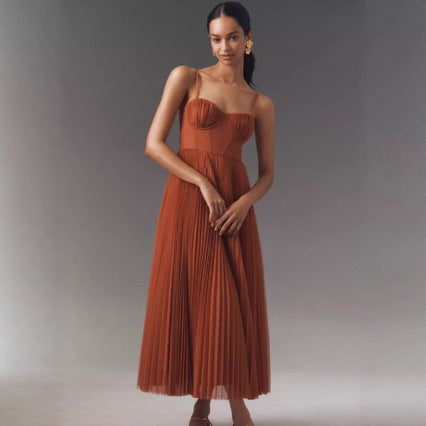 Versatile women's pleated maxi dress with a chic bustier top and flared skirt, ideal for summer or evening wear.