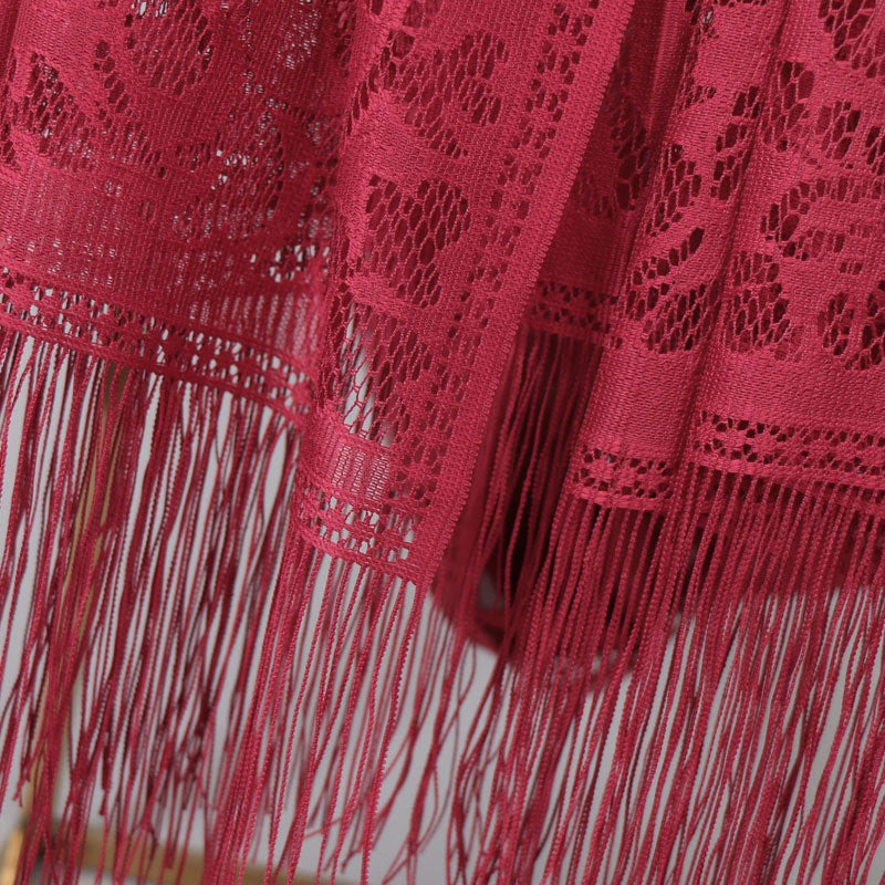 Beautiful floral lace scarf for women, featuring elegant fringe details, a timeless fashion piece.