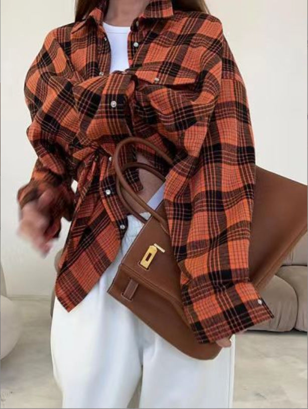 Stylish blue plaid long-sleeve button-up shirt for women, oversized fit, ideal for fall fashion.