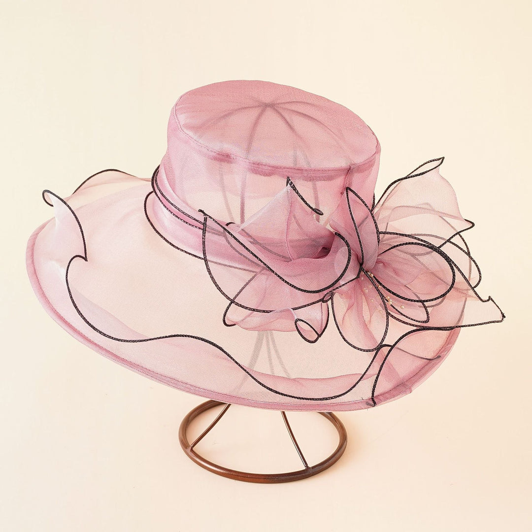 Chic women's wide brim mesh sun hat with a romantic bow, perfect for elegant summer outings.
