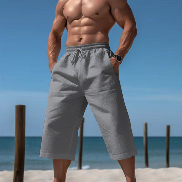 Comfortable men's summer shorts with pockets, great for beach days & relaxed outings.
