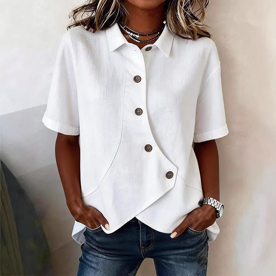 Women's relaxed fit blouse with elegant wavy pattern and distinct button accents, suitable for everyday wear.
