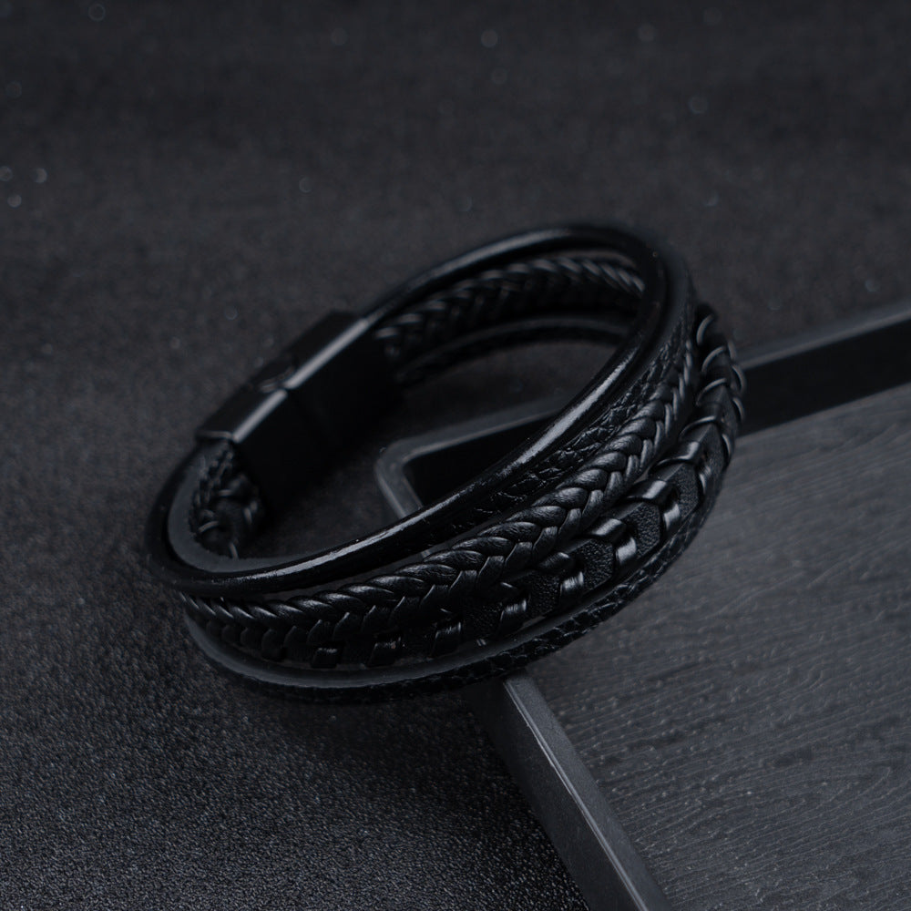 Detailed close-up of a men's braided leather Viking bracelet with a strong magnetic clasp.