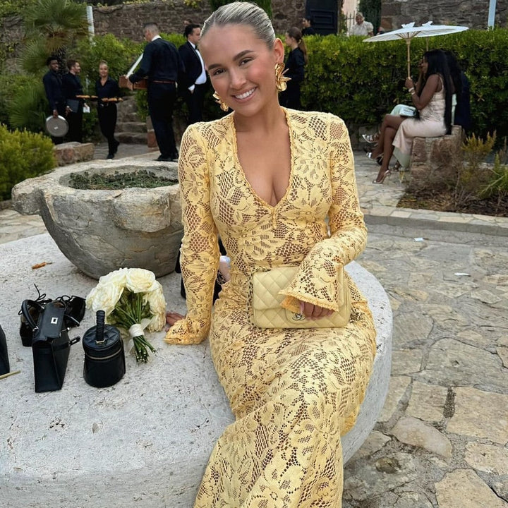 Elegant women's V-neck lace maxi dress, featuring voluminous sleeves & a sophisticated tailored fit. Long party gown.