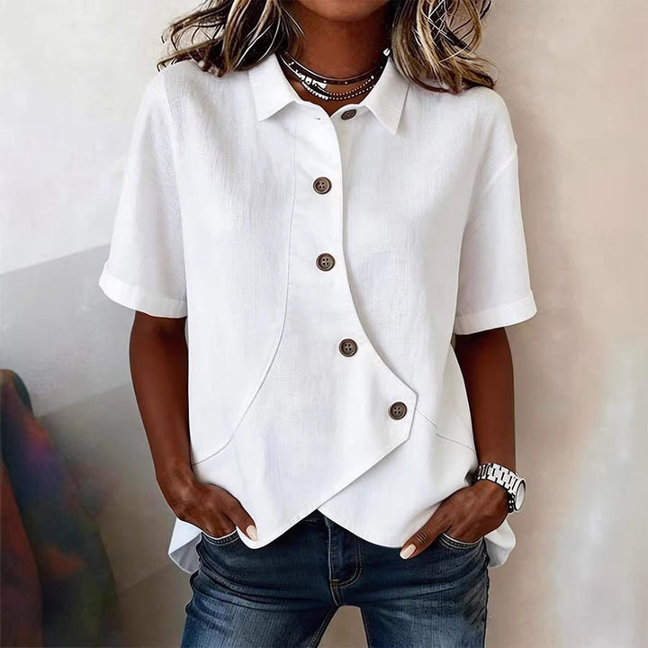 Versatile elegant blouse for women, showcasing a unique button placket and subtle wavy print design.