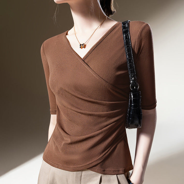 Elegant women's wrap top with V-neck, half sleeves & sophisticated draping. Versatile and flattering fit.