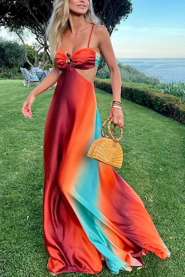 Women's flowing sunset maxi dress, elegant and sleeveless, perfect for summer parties or vacation wear.