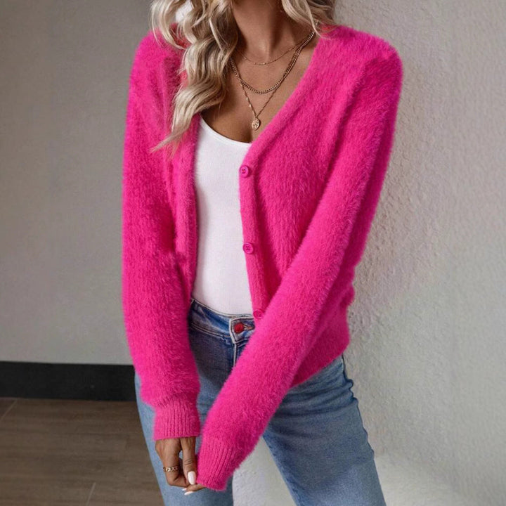 Ultra-soft women's fluffy V-neck cardigan with classic buttons, ensuring cozy comfort and style.